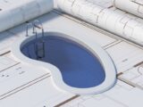 Geplantes Gartenbecken auf Bauplaenen als Symbolbild fuer die Vorbereitung und Standortwahl beim Kauf eines Pool Komplettset